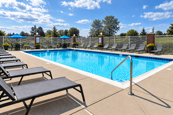 Poolside sundeck with chaise lounges